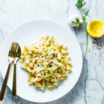 garlicky pasta with lemon olive oil and pine nuts vertical